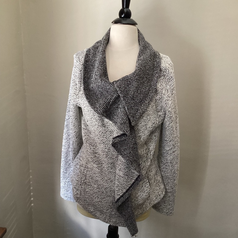Sweater with off-center zipper.  Very flattering